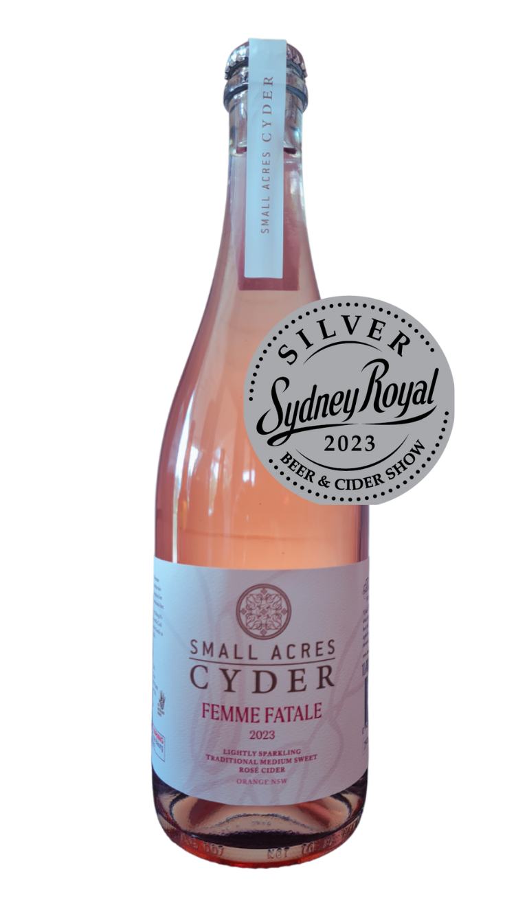 a 750ml bottle of Small Acres Cyder Femme Fatale apple cider. The cider is a Rose cider and has a salmon hue. Also features a Silver Medal from Sydney Royal Beer and Cider Show 2023