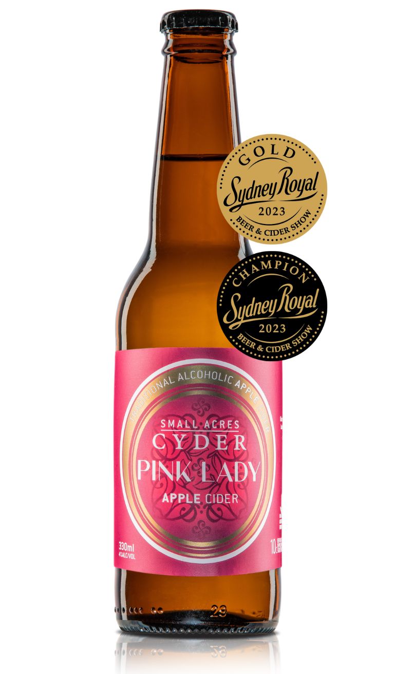 330ml bottle of Pink Lady apple cider with medals: a Sydney Royal Champion Cider 2023 and Sydney Royal Gold 2023