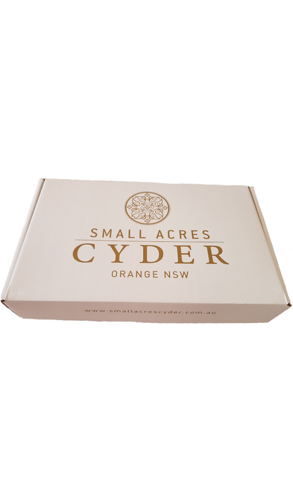 A flat box with the Small Acres Cyder logo on it