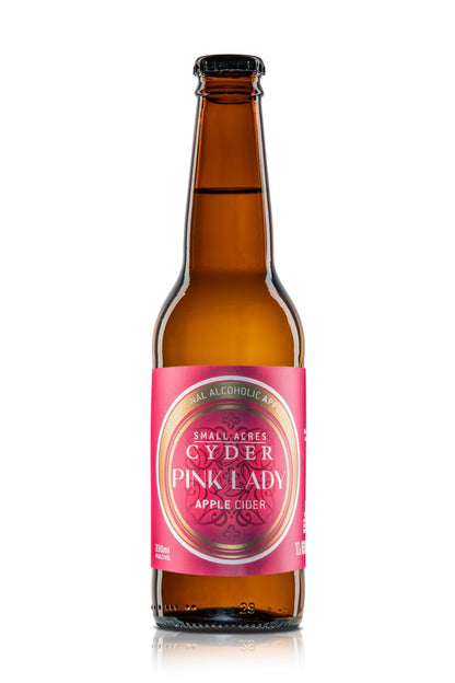 A single bottle of Small Acres Cyder Pink Lady apple cider with a pink label and a brown 330ml bottle